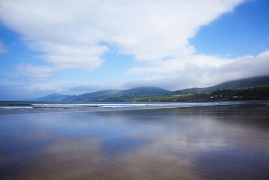 Clouds Reflected On The Wet Sand Of Inch Beach In Dingle Wall Mural