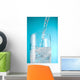 Stream Of Water Being Poured Into A Clear Glass Wall Mural