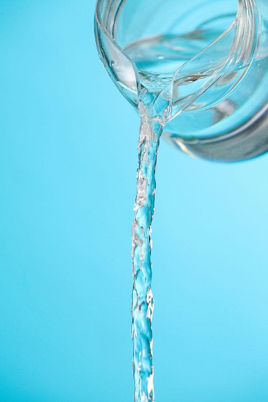 Stream Of Water Being Poured From A Pitcher Wall Mural