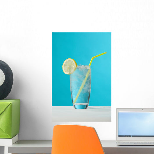 Clear Glass Of Water With Lemon And Drinking Straw Wall Mural