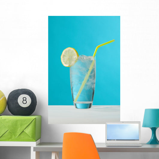 Clear Glass Of Water With Lemon And Drinking Straw Wall Mural