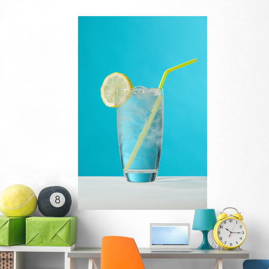 Clear Glass Of Water With Lemon And Drinking Straw Wall Mural