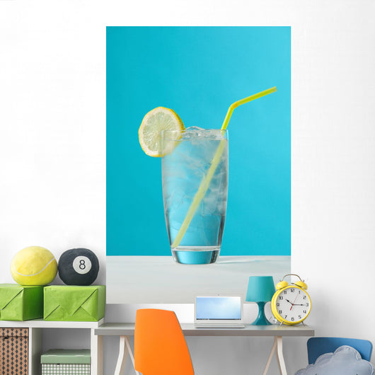 Clear Glass Of Water With Lemon And Drinking Straw Wall Mural