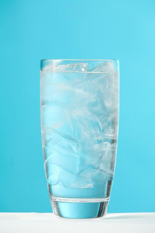 Very Full Glass Of Water With Ice Wall Mural