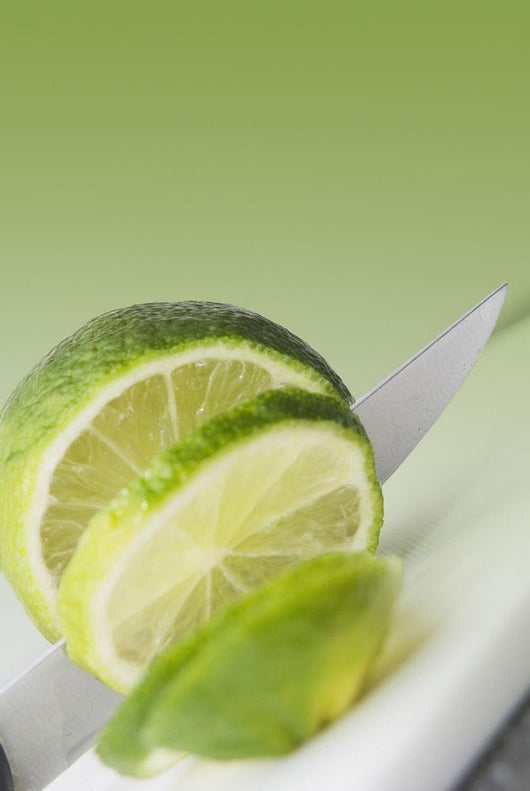 A Knife Cutting A Lime Wall Mural