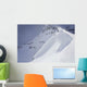Skier On Crest Of Big Drop, Dwarfed By Mountain Wall Mural