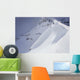 Skier On Crest Of Big Drop, Dwarfed By Mountain Wall Mural