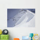 Skier On Crest Of Big Drop, Dwarfed By Mountain Wall Mural