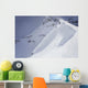 Skier On Crest Of Big Drop, Dwarfed By Mountain Wall Mural