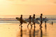 Surfers at Sunset Wall Mural