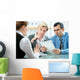 mid-adult couple meeting with financial planner Wall Mural
