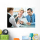 mid-adult couple meeting with financial planner Wall Mural