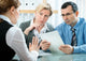 mid-adult couple meeting with financial planner Wall Mural