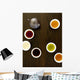 Teapot And Different Types Of Tea In Cups On A Wood Table Wall Mural