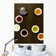 Teapot And Different Types Of Tea In Cups On A Wood Table Wall Mural