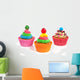 three colorful creamed cupcakes with a cherry and chocolate on t Wall Decal