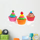 three colorful creamed cupcakes with a cherry and chocolate on t Wall Decal