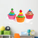 three colorful creamed cupcakes with a cherry and chocolate on t Wall Decal