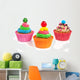 three colorful creamed cupcakes with a cherry and chocolate on t Wall Decal