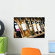 Closeup shot of wineshelf. Bottles lay over straw. Wall Mural
