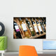 Closeup shot of wineshelf. Bottles lay over straw. Wall Mural