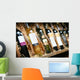 Closeup shot of wineshelf. Bottles lay over straw. Wall Mural