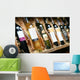 Closeup shot of wineshelf. Bottles lay over straw. Wall Mural