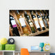 Closeup shot of wineshelf. Bottles lay over straw. Wall Mural