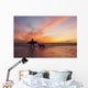 A Surfer Walks In Shallow Water With Her Dog At Sunset Wall Mural