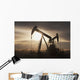 Silhouette Of Two Pump Jacks At Sunrise With Clouds Wall Mural