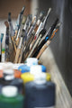 Paint Brushes And Paint Containers In A Classroom Wall Mural