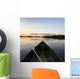 A Boat And Paddle On A Tranquil Lake At Sunset Wall Mural