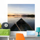 A Boat And Paddle On A Tranquil Lake At Sunset Wall Mural