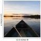A Boat And Paddle On A Tranquil Lake At Sunset Wall Mural