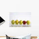 Four Yellow Apples With One Red Apple In A Row On A Reflective Surface Wall Mural