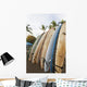 Surfboards Standing Up Against A Rack On The Beach Wall Mural