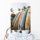 Surfboards Standing Up Against A Rack On The Beach Wall Mural