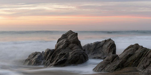 Mist Surrounding Rocks In The Ocean At The Coast At Sunset Wall Mural