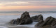 Mist Surrounding Rocks In The Ocean At The Coast At Sunset Wall Mural