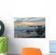 Water Washing Up On The Beach Around The Rocks At Sunset Wall Mural