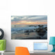 Water Washing Up On The Beach Around The Rocks At Sunset Wall Mural