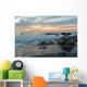 Water Washing Up On The Beach Around The Rocks At Sunset Wall Mural
