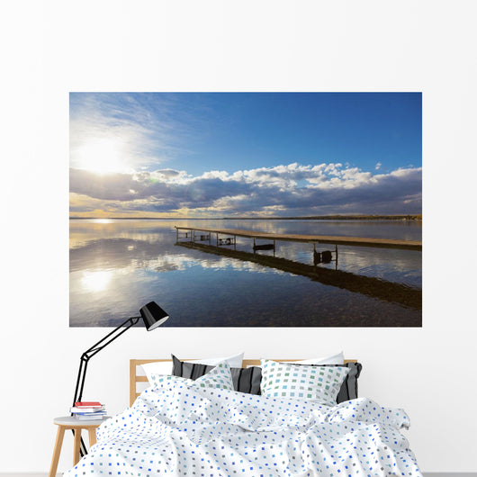 A Dock Leading Out Into The Lake At Sunrise Wall Mural