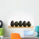 A Row Of Avocados Standing Upright On A Wooden Board Wall Mural