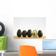 A Row Of Avocados Standing Upright On A Wooden Board With One Cut Wall Mural