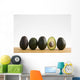 A Row Of Avocados Standing Upright On A Wooden Board With One Cut Wall Mural