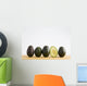 A Row Of Avocados Standing Upright On A Wooden Board With One Cut Wall Mural