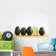 A Row Of Avocados Standing Upright On A Wooden Board With One Cut Wall Mural