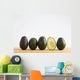 A Row Of Avocados Standing Upright On A Wooden Board With One Cut Wall Mural