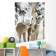 Two Young Deer In A Snow Covered Forest Chewing On Tree Bark Wall Mural